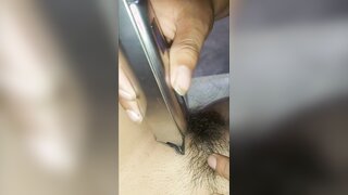 In this explicit video, a neighbor helps a woman shave her vagina and ass, leading to a steamy encounter.