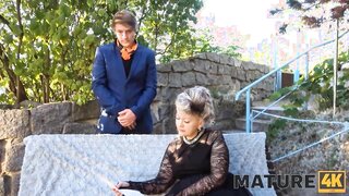In this video, a mature blonde granny with grey hair indulges in a sensual encounter. She receives a thorough cunnilingus in outdoor settings, wearing stockings.