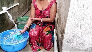 Indian wife taking a bath on balcony gets surprised by lover, leading to passionate outdoor sex.