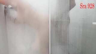 In this image, a mature woman indulges in self-pleasure with her husband\'s big cock, creating an intimate and steamy shower scene.