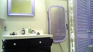Destini_schultist, a tantalizing chick with purple hair, unveils her small boobs and trimmed pussy in a solo bathroom session. Sex videos.